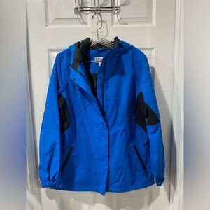 Port Authority women’s rain coat jacket, waterproof with hood, never worn. Blue